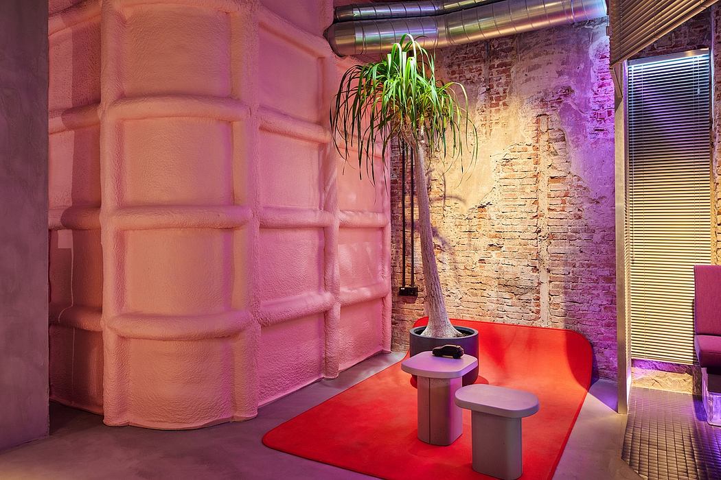 A vibrant and eclectic interior design featuring exposed brick walls, colorful lighting, and unique furnishings.