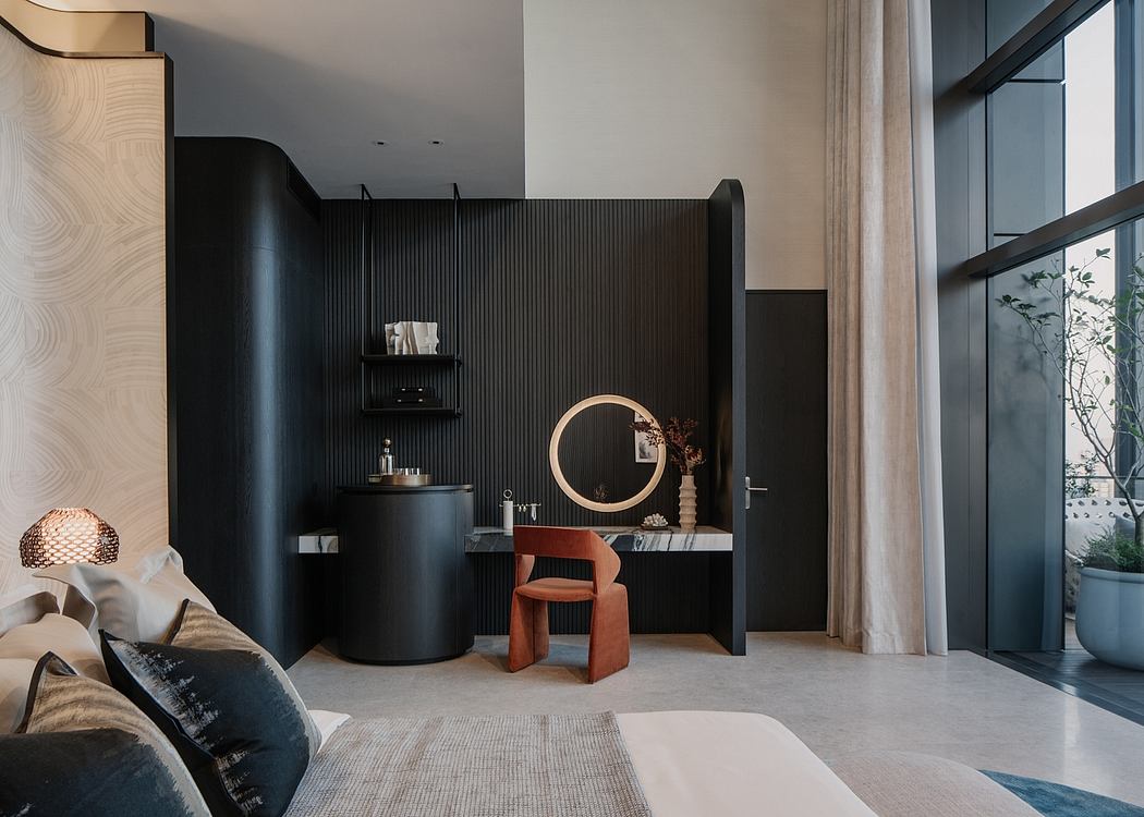 A modern, minimalist bedroom with a black accent wall, circular mirror, and sleek furnishings.