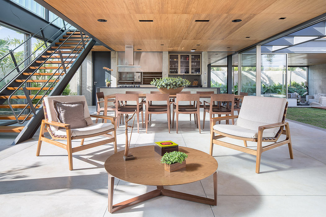 An open-concept living and dining area with a modern, wood-paneled interior.