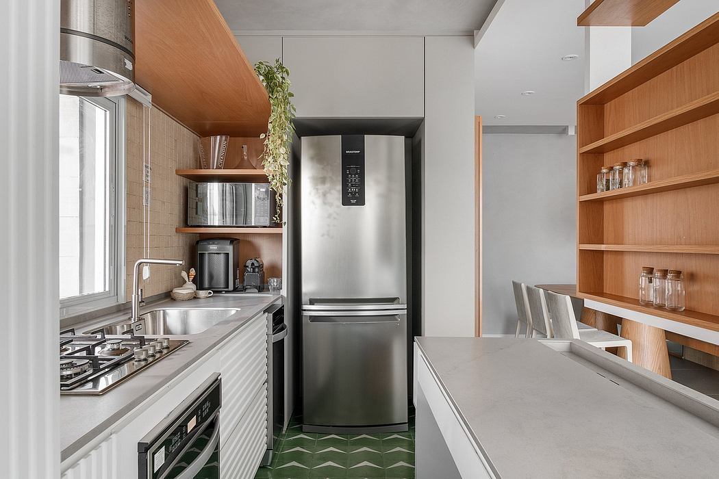 Modern kitchen with stainless steel refrigerator, wooden shelves, and tiled floor.