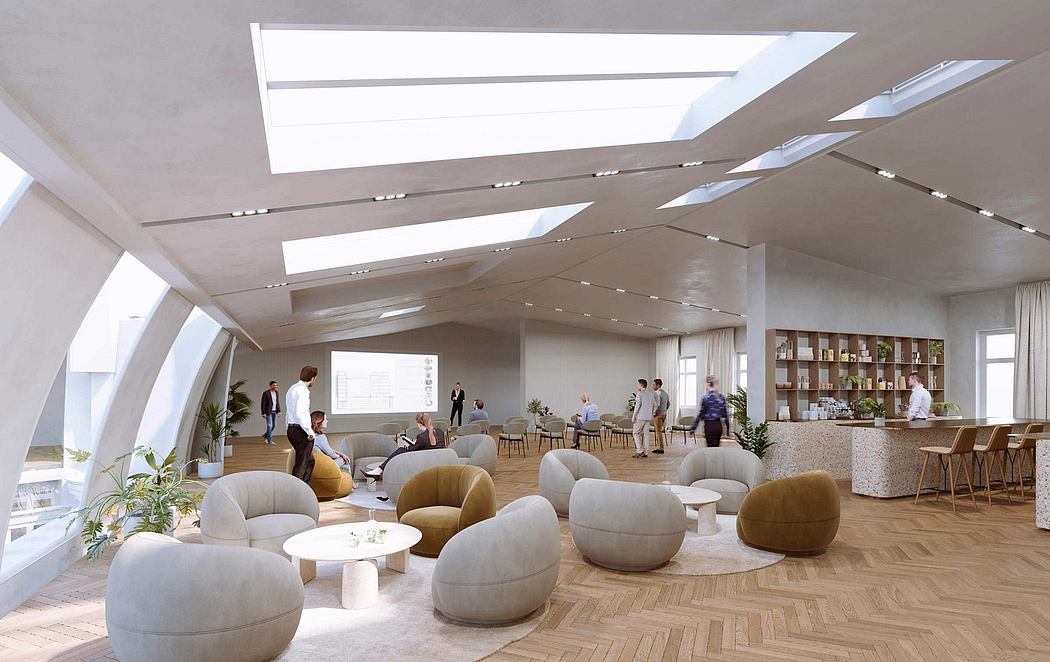 Spacious modern office lounge with skylights, wood floors, and comfortable seating.