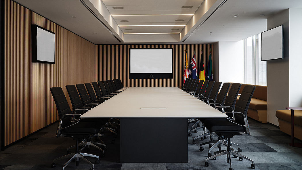 Sleek, modern conference room with wood-paneled walls, large screen, and rows of black chairs.
