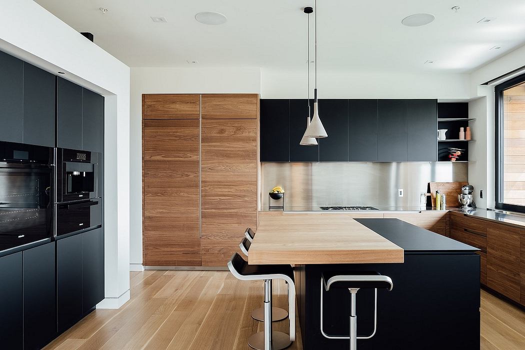Sleek, modern kitchen with dark cabinets, wooden accents, and a central island.