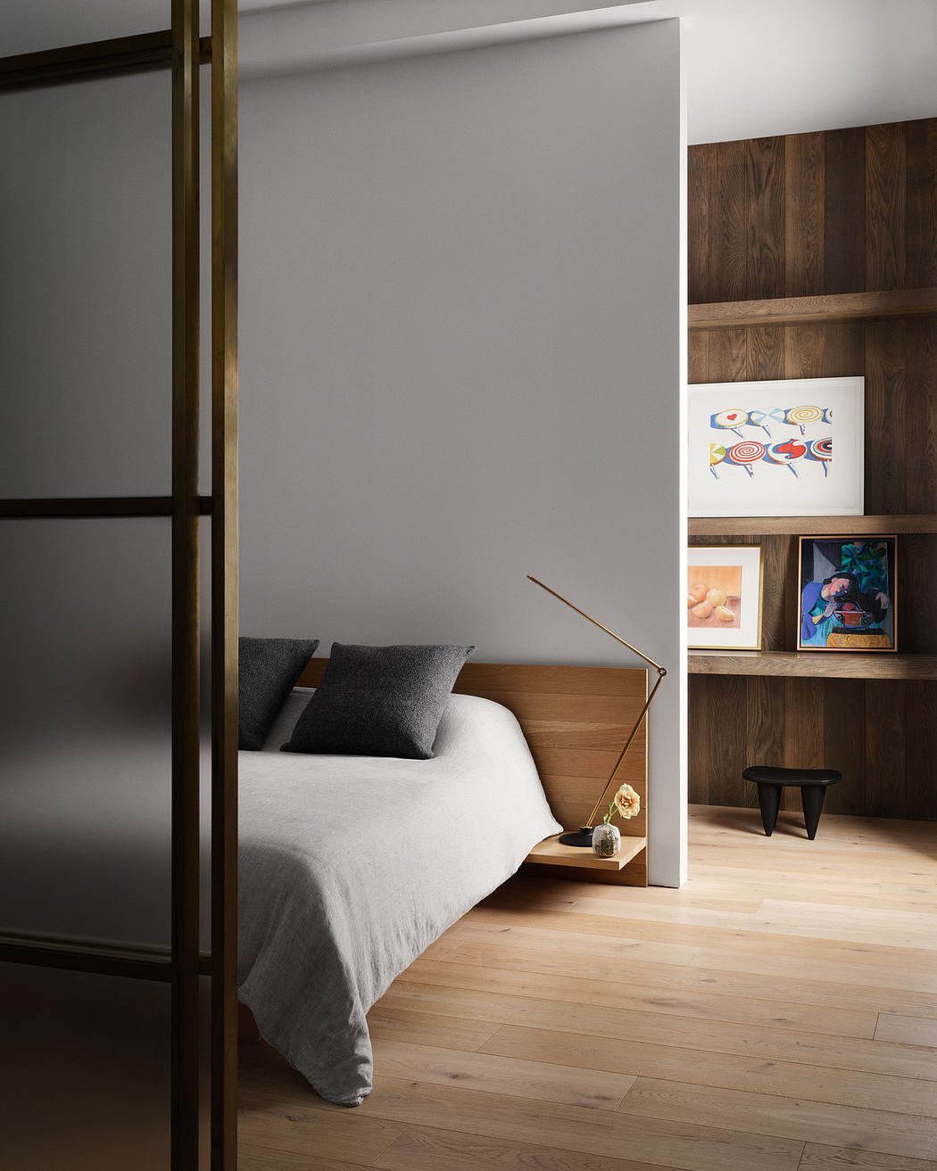 Serene bedroom with wood paneling, built-in shelving, and minimalist lighting.
