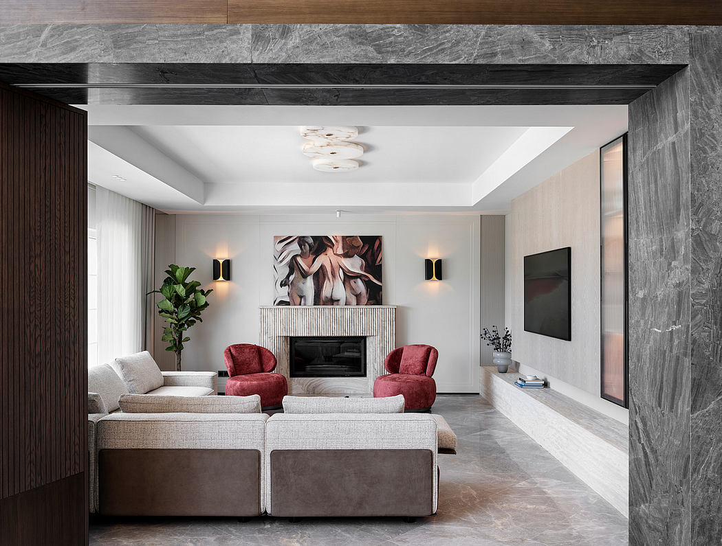 Minimalist living room with stone fireplace, plush seating, and abstract artwork.