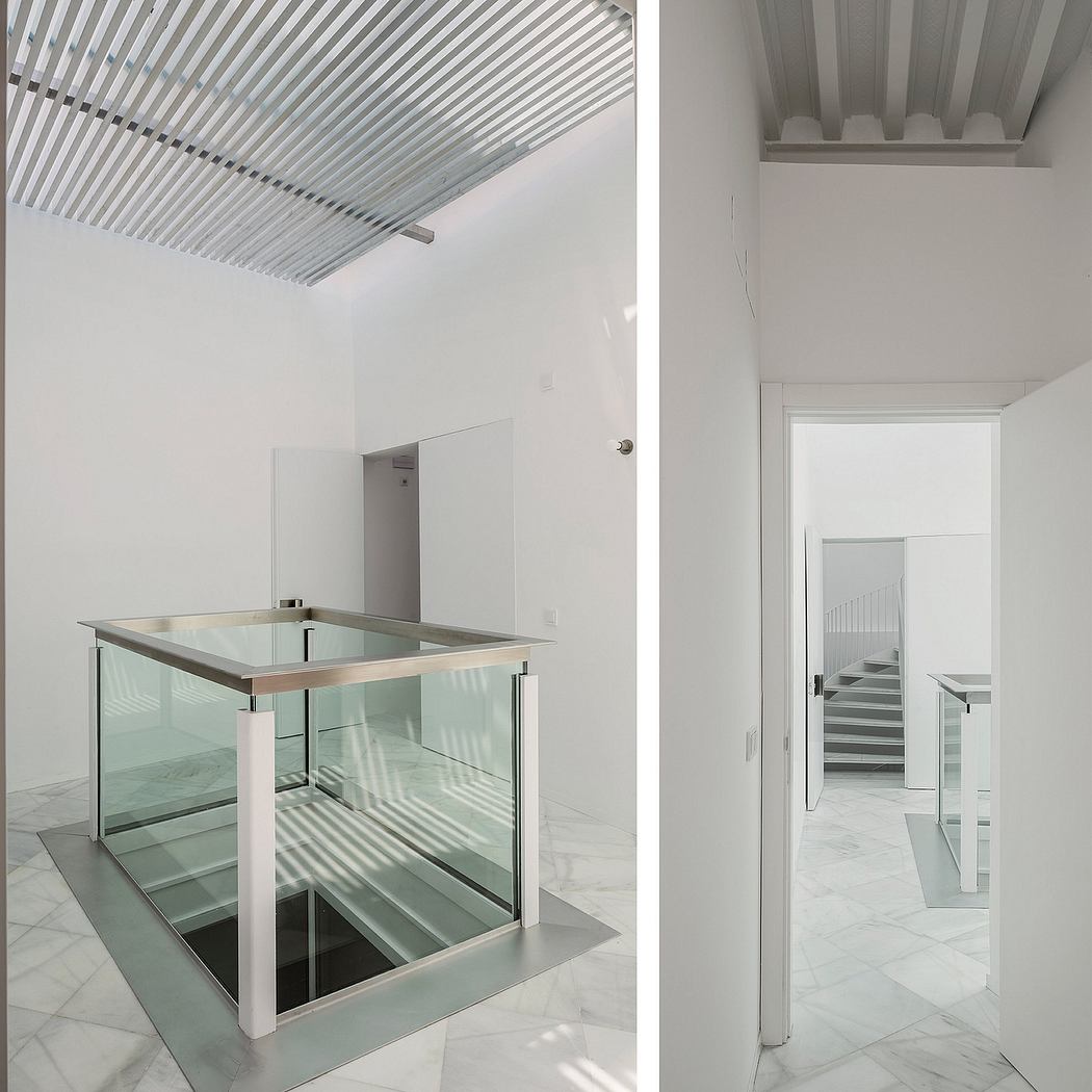 The image showcases a modern, minimalist interior design with a glass display enclosure and a corrugated ceiling.