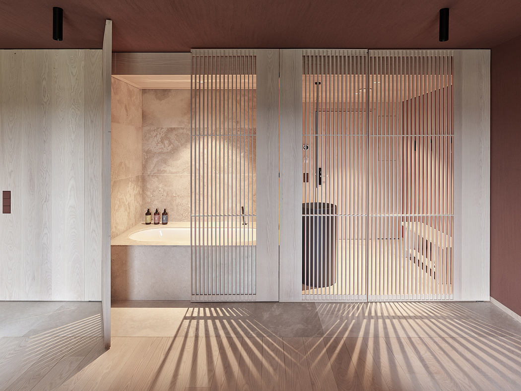 Minimalist bathroom with wooden slat screens, stone vanity, and dramatic lighting.