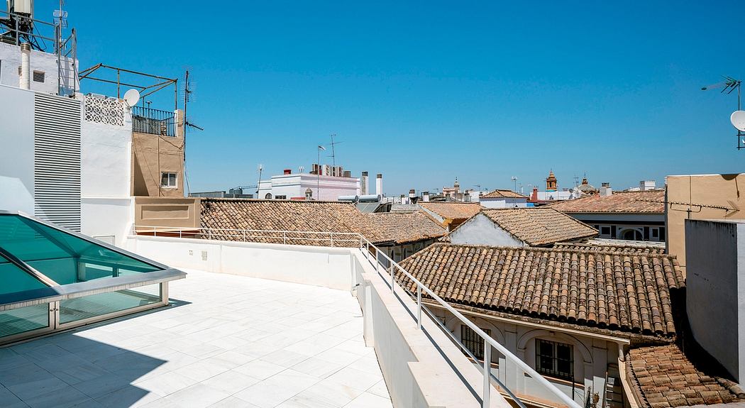 Rooftop view of distinctive Spanish tile roofs and architectural details.