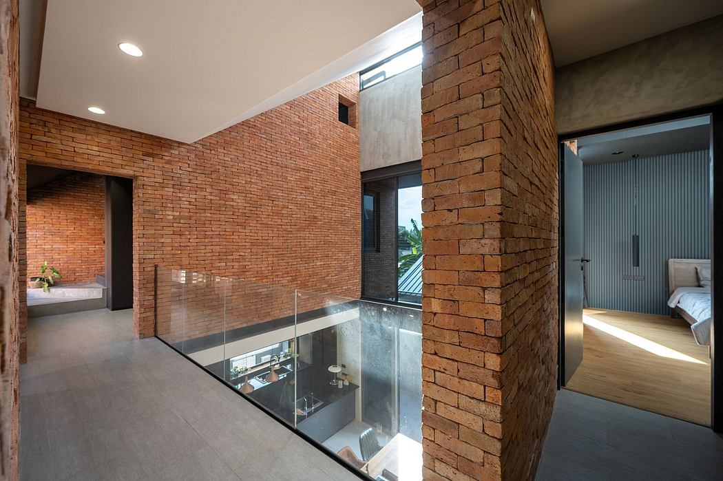 Contemporary brick interior with glass balcony, modern lighting, and open layout.