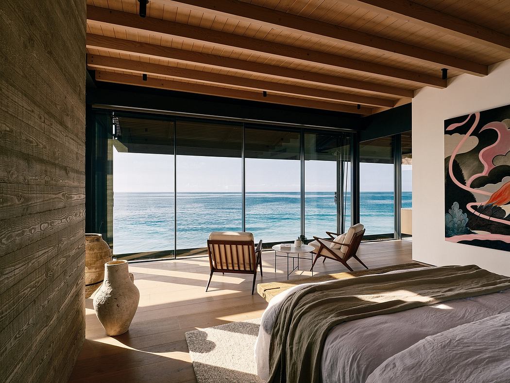 Wooden cabin with floor-to-ceiling windows overlooking the tranquil ocean view.