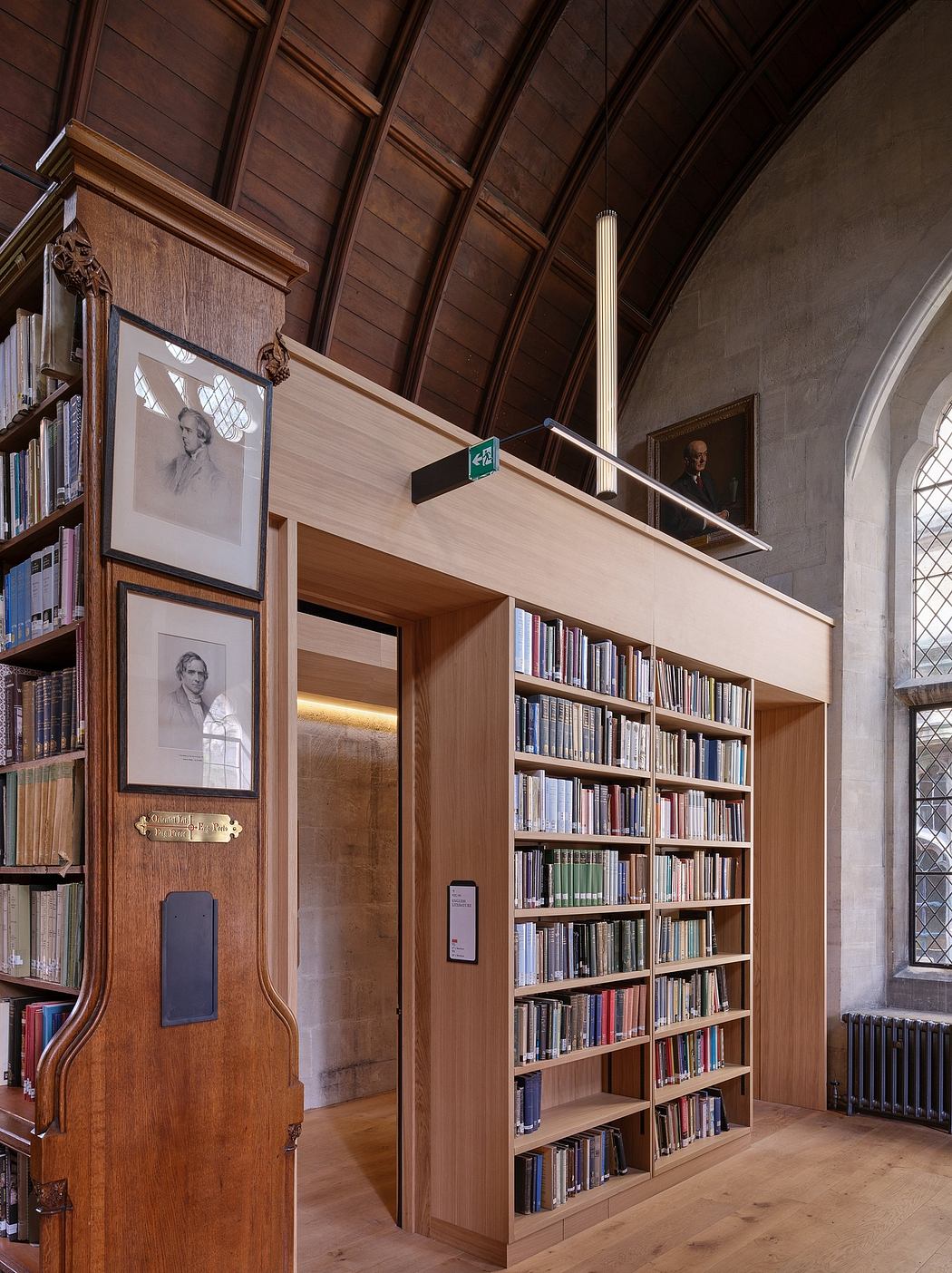 A spacious, wood-paneled library with ornate architectural features and extensive bookshelves.