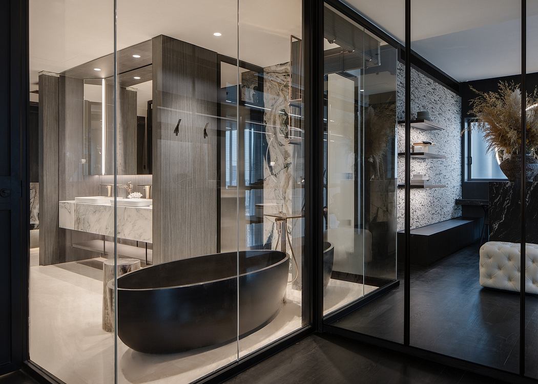 Sleek, modern bathroom with a freestanding tub, glass shower, and marble vanity.