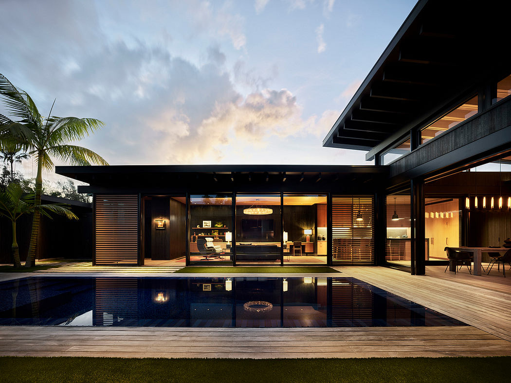 Stunning modern tropical villa with sleek wooden architecture, reflecting pool, and lush palm trees.