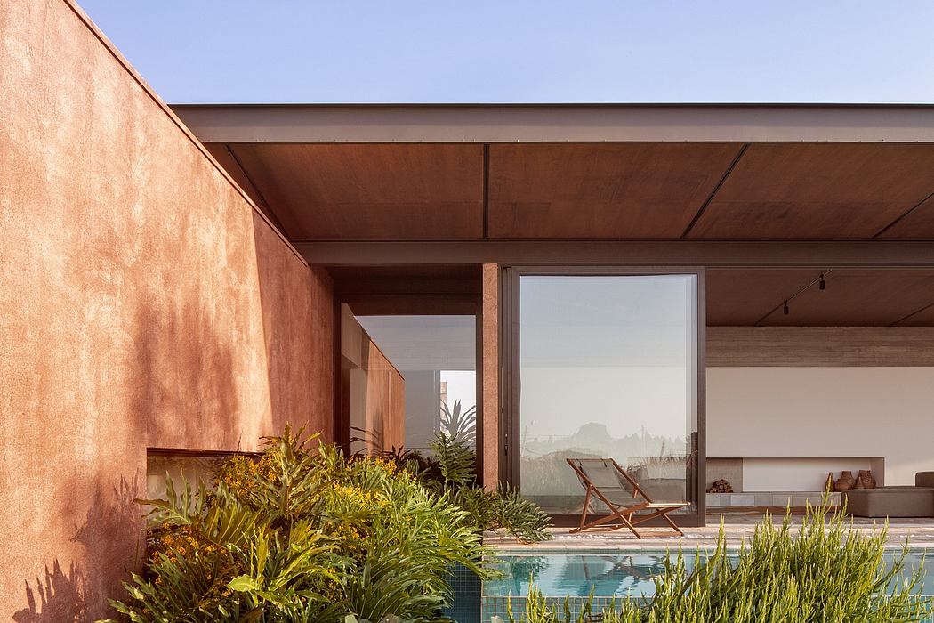 A serene modern villa with a private pool surrounded by lush tropical foliage.