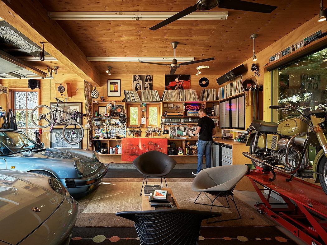 Cozy garage workshop with wooden walls, eclectic decor, and a vintage motorcycle.