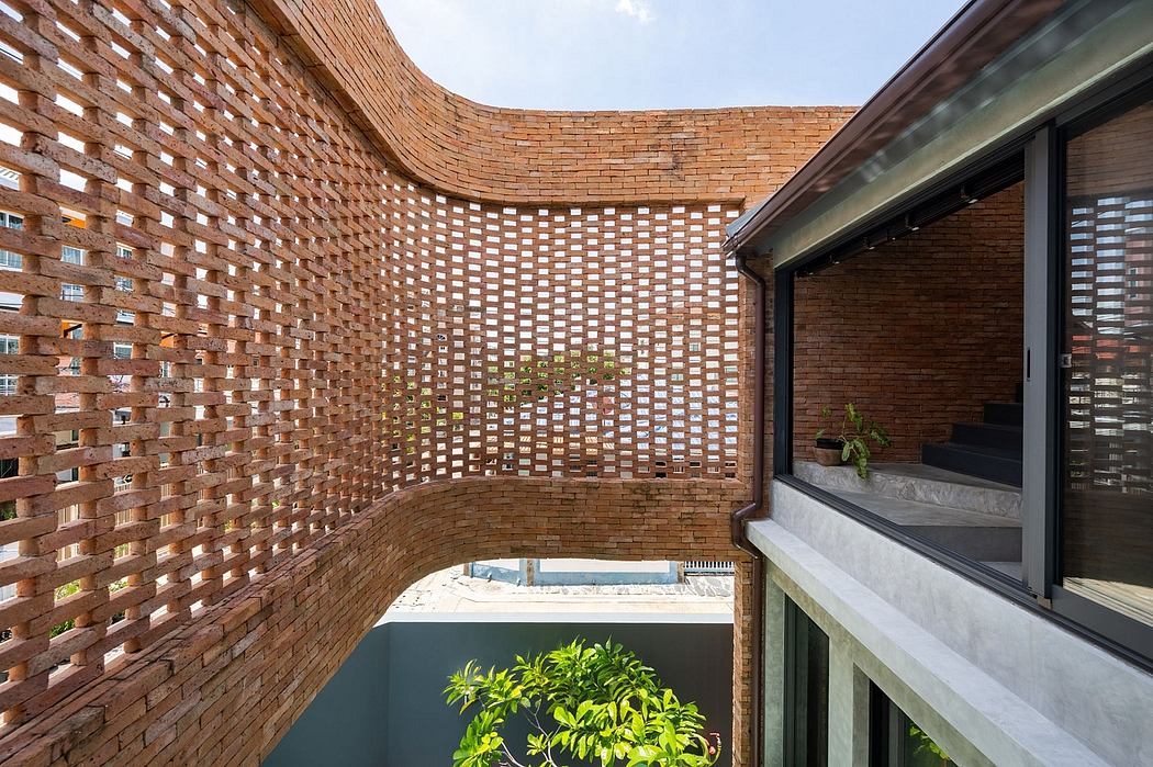 Intricate brick facade with latticed patterns creates a visually striking architectural design.