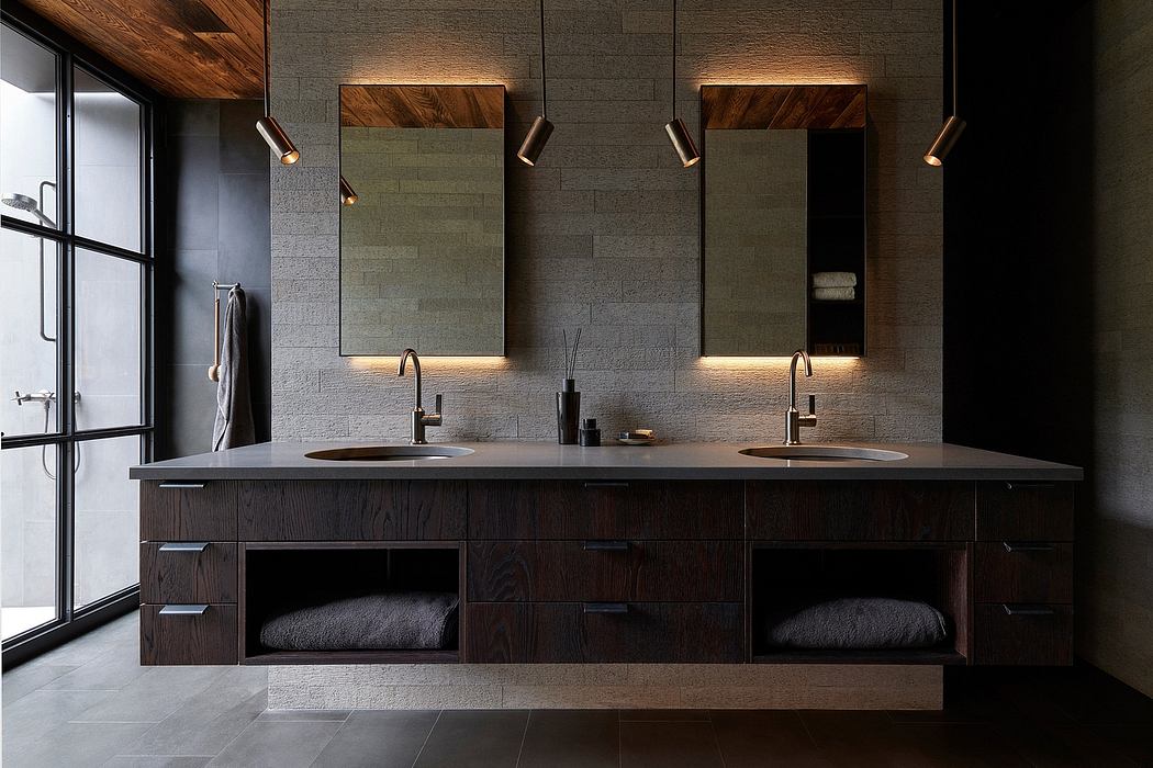 Luxurious bathroom with modern vanity, dual sinks, and recessed lighting fixtures.