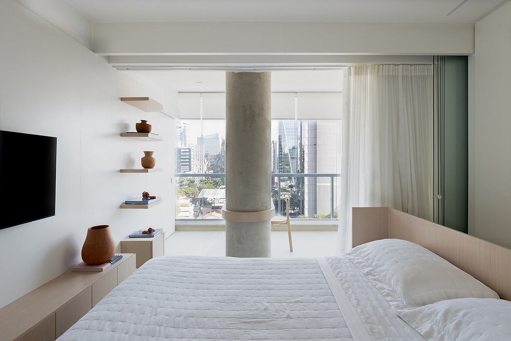Minimalist bedroom with large window, built-in shelving, and neutral color palette.