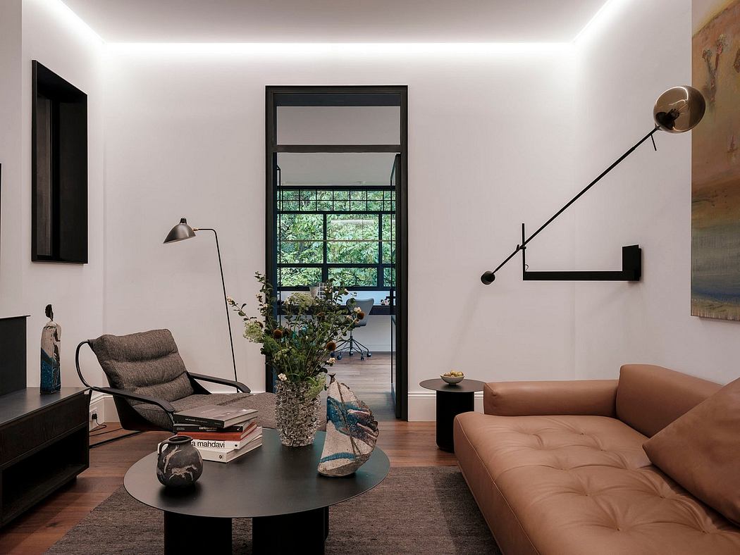 Modern living room with minimalist furniture, floor-to-ceiling windows, and industrial-style lighting fixtures.