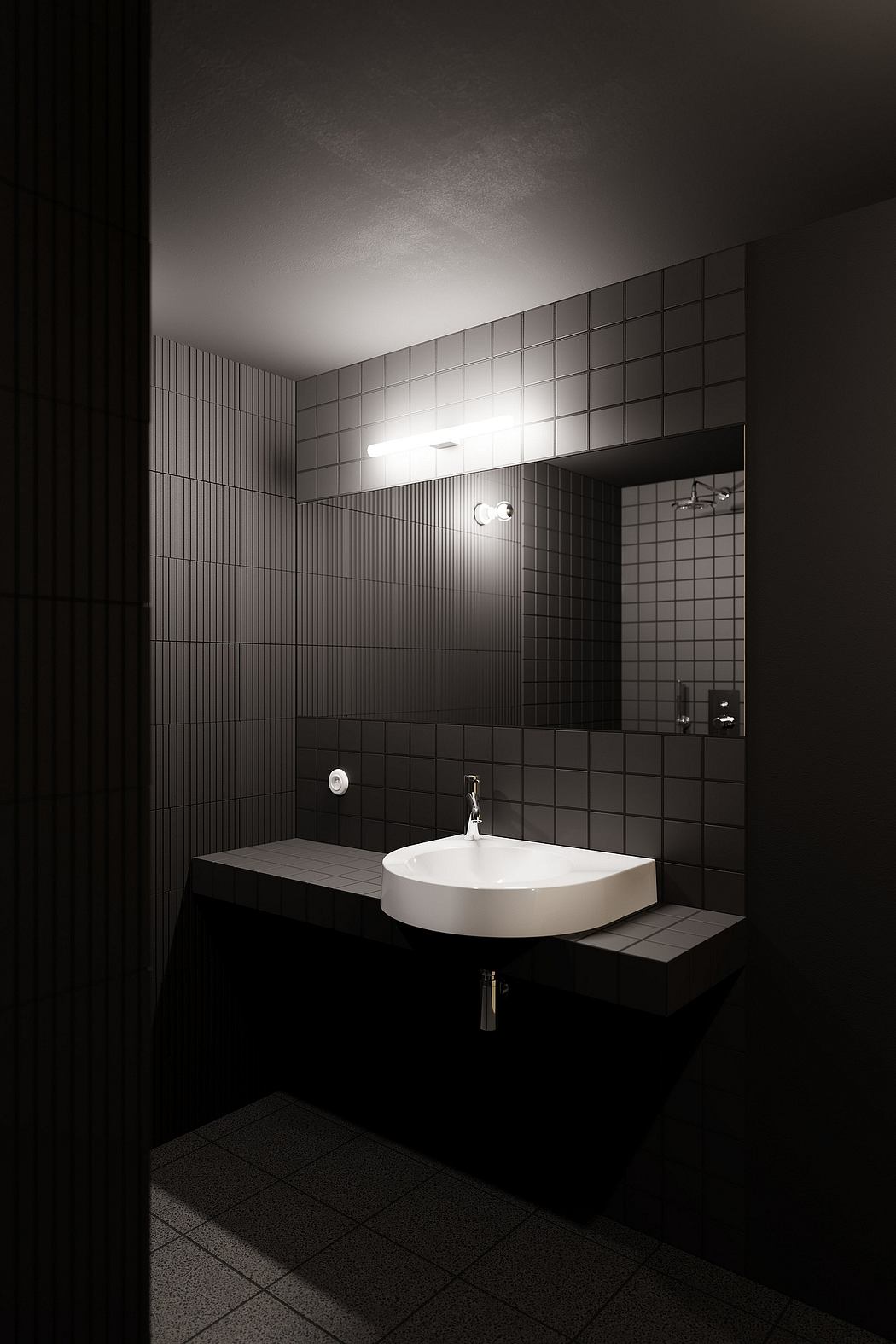 A minimalist bathroom with sleek black tiles, a white sink, and indirect lighting.