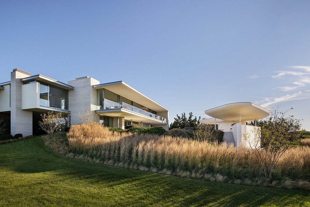 Sleek modern architecture with large windows and unique landscaping features.