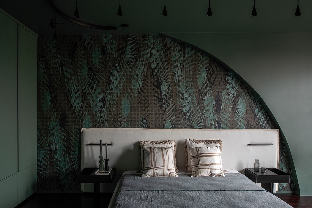 Dramatic curved wall with textured pattern, plush bed, and minimalist nightstands.