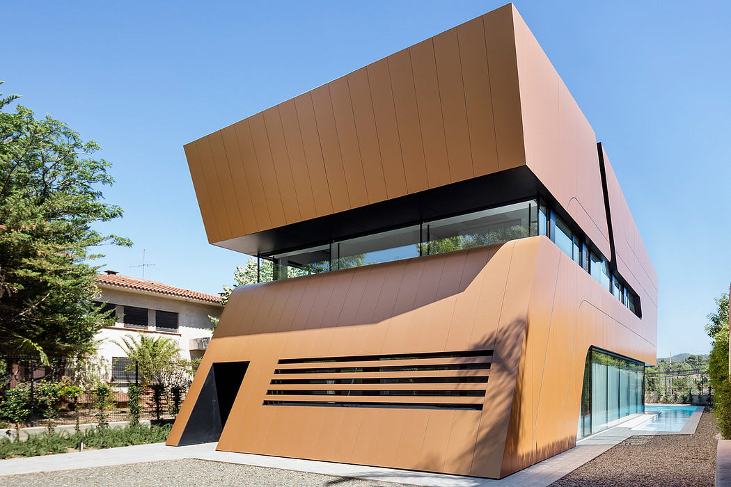 Striking modern structure with angular, geometric facade and glass elements.