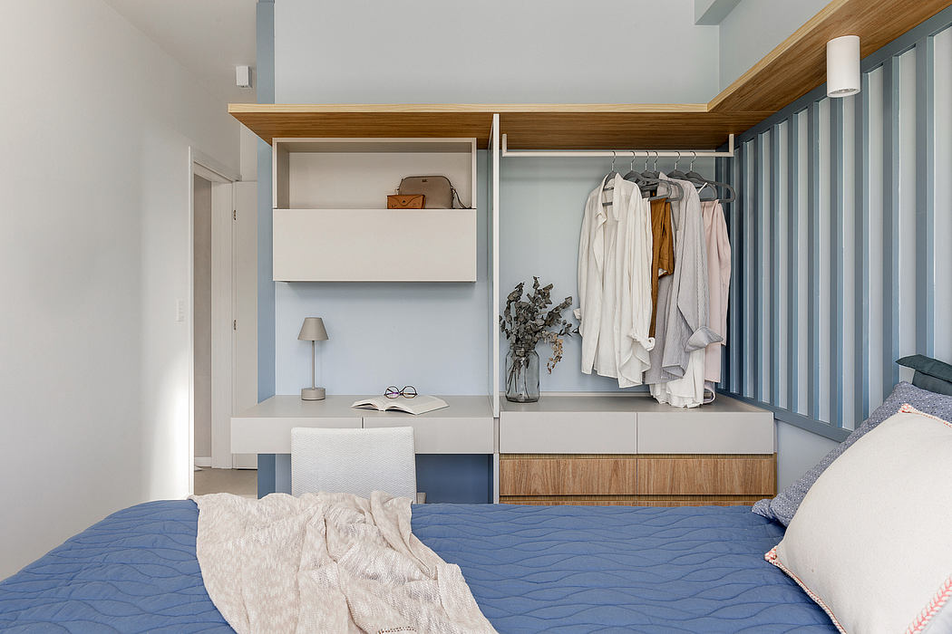 A modern bedroom with a built-in wardrobe, wooden accents, and a cozy, minimalist aesthetic.