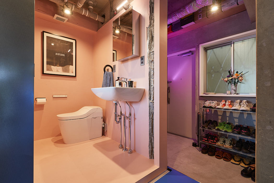 Compact bathroom with exposed brick, modern fixtures, and a built-in shoe storage closet.