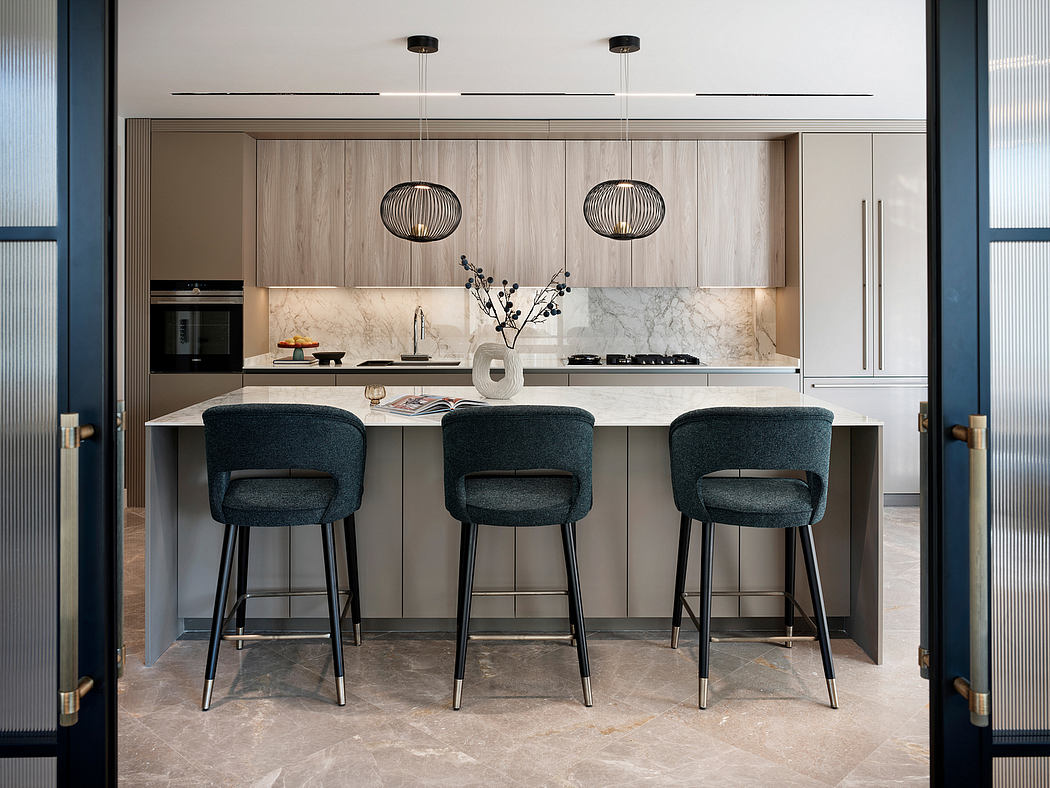 Elegant modern kitchen with sleek wood cabinetry, marble countertop, and pendant lights.