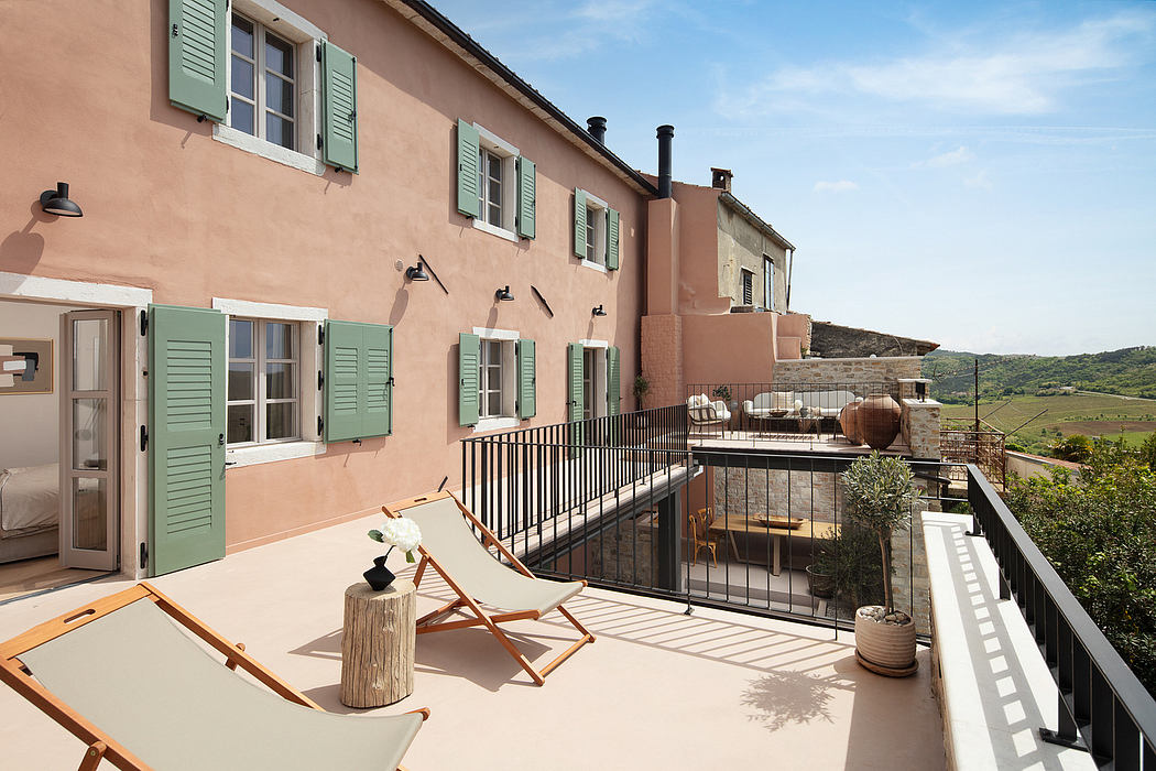 Charming Mediterranean-style villa with colorful shutters and inviting balcony.