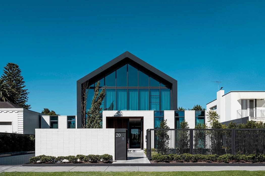 Contemporary architectural design with contrasting materials, clean lines, and inviting entrance.