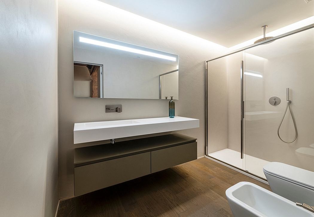 Sleek, modern bathroom design featuring a floating vanity, large mirror, and glass shower.