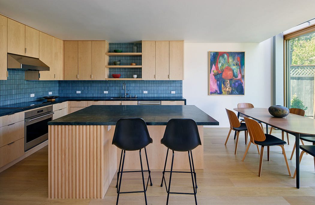 Bright, modern kitchen with wooden cabinets, blue tile backsplash, and open dining area.