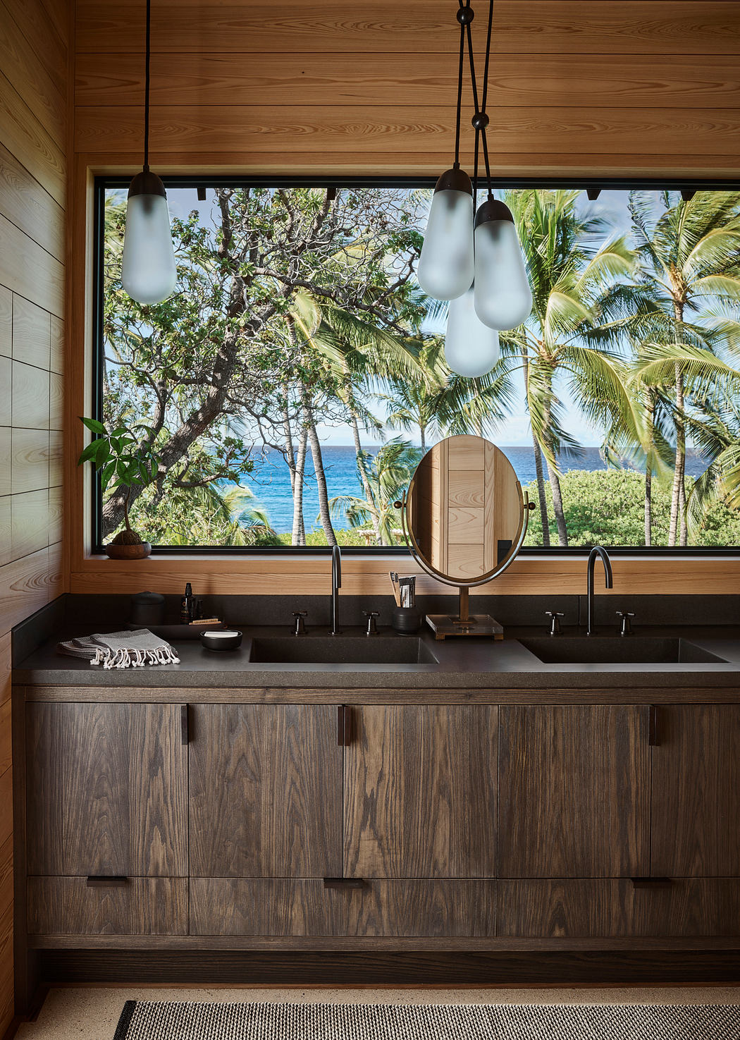 Serene bathroom oasis with nature-inspired design elements and stunning ocean views.