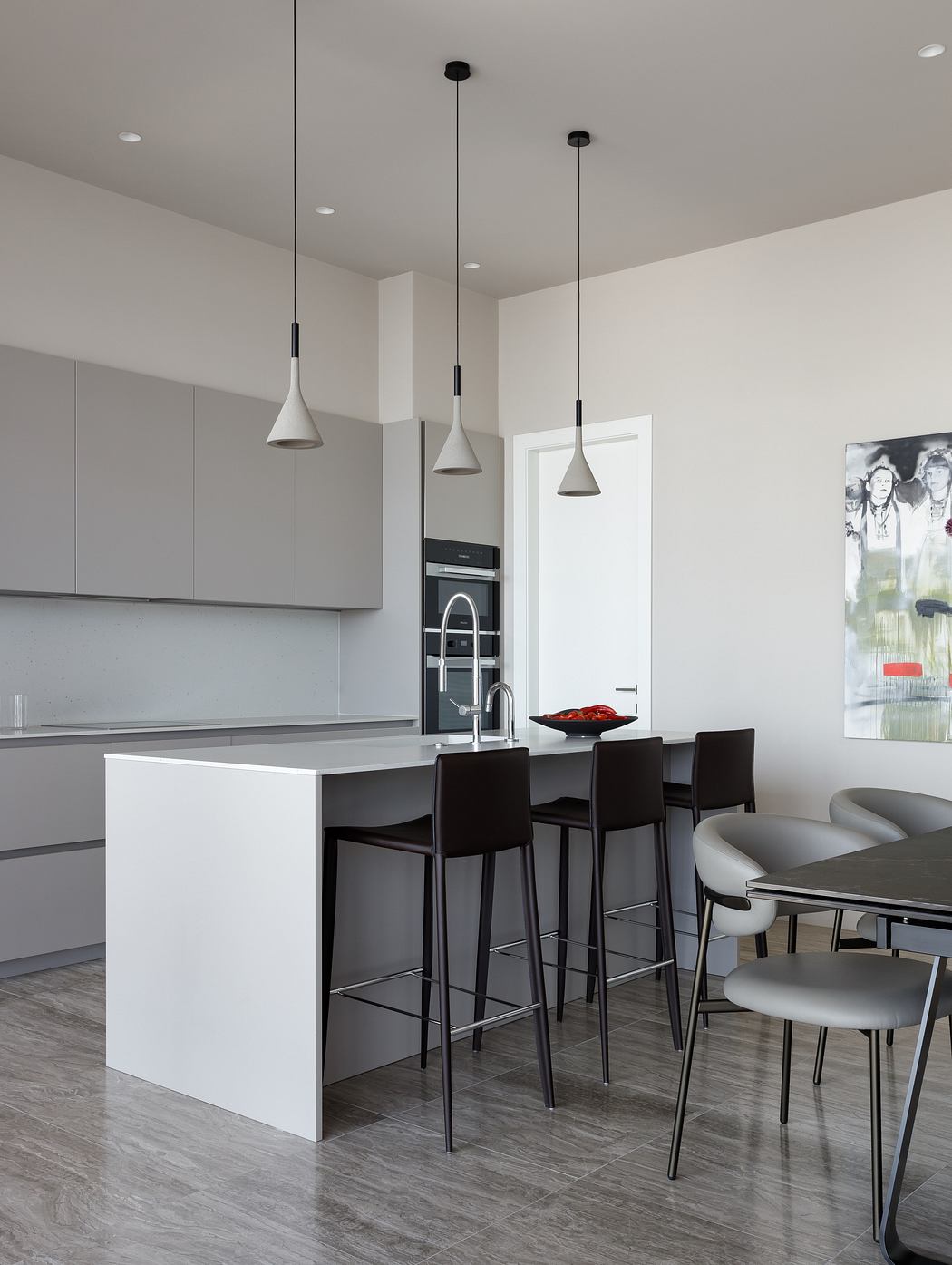 Minimalist kitchen with sleek grey cabinets, pendant lights, and a modern dining area.