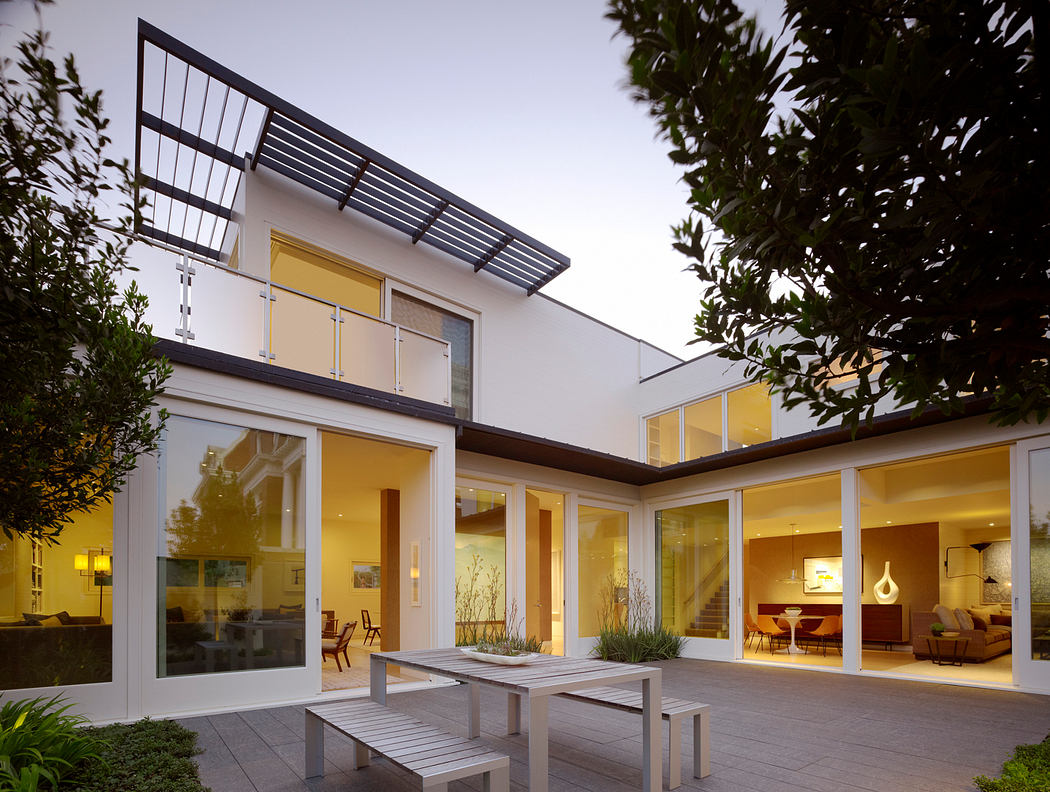 A modern, stylish home with large windows, an open-concept layout, and a sleek exterior.