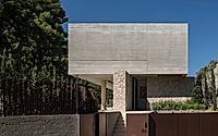 001-residence-in-dionysos-monolithic-concrete-dwelling-nestled-in-penteli.jpg