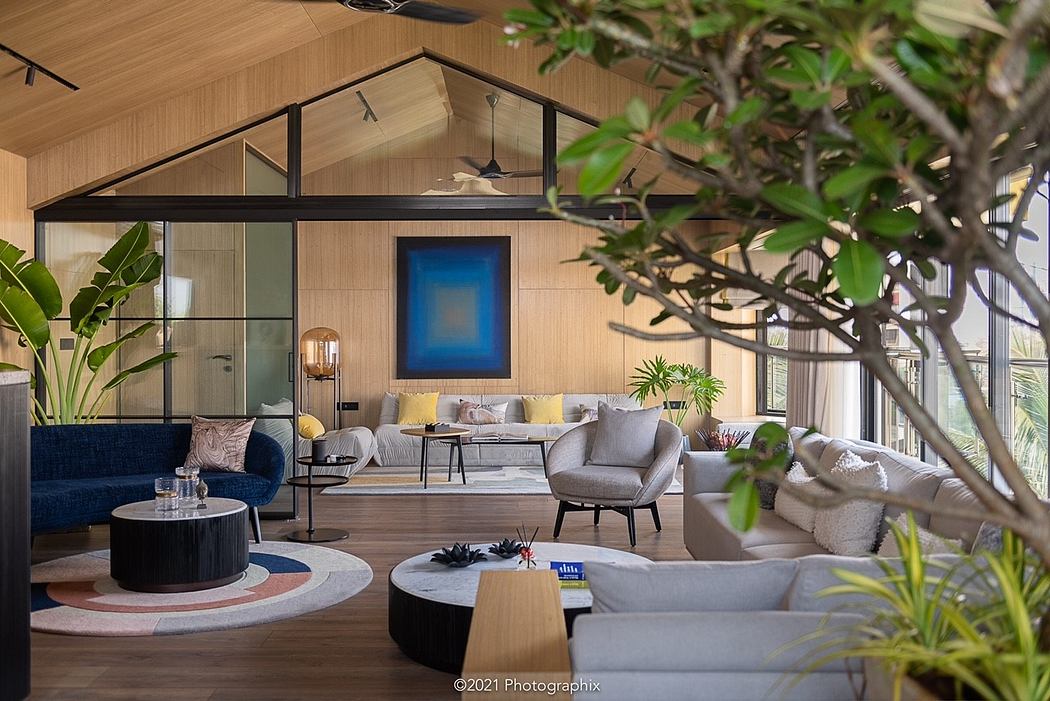 Cozy interior with wooden accents, plush furniture, and lush greenery creating a serene ambiance.