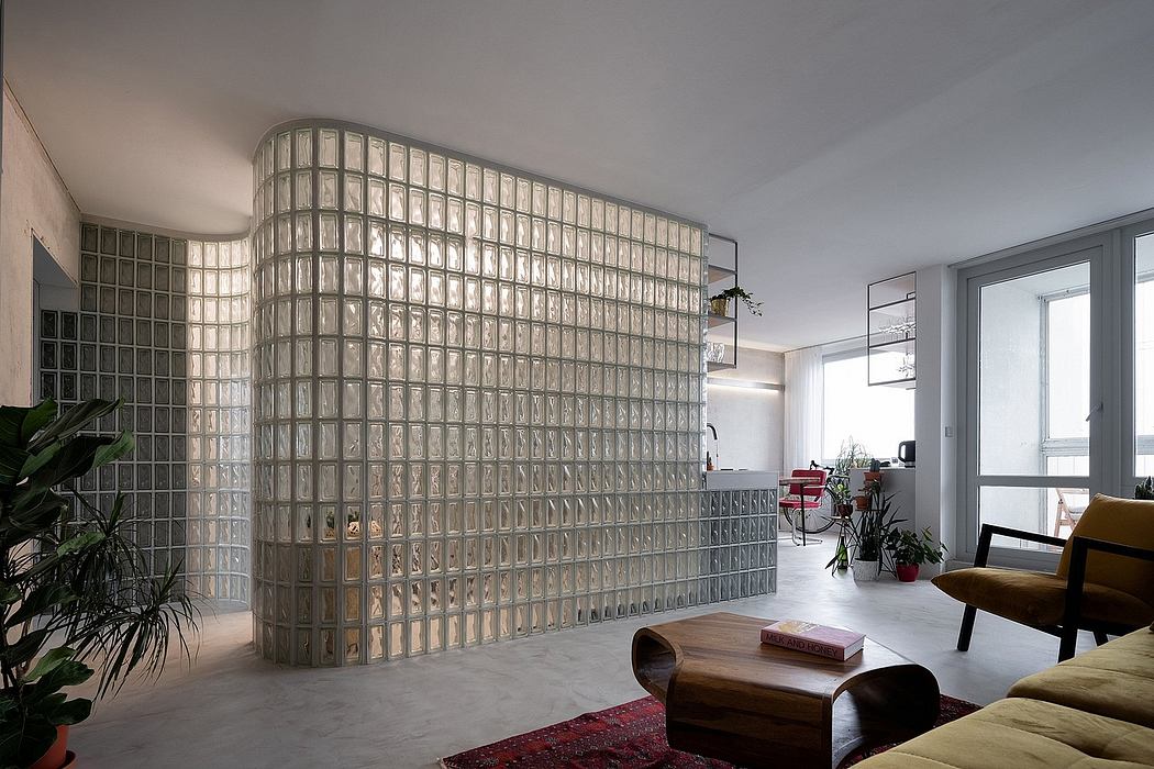 Stunning glass block wall dividing the modern, open living space.