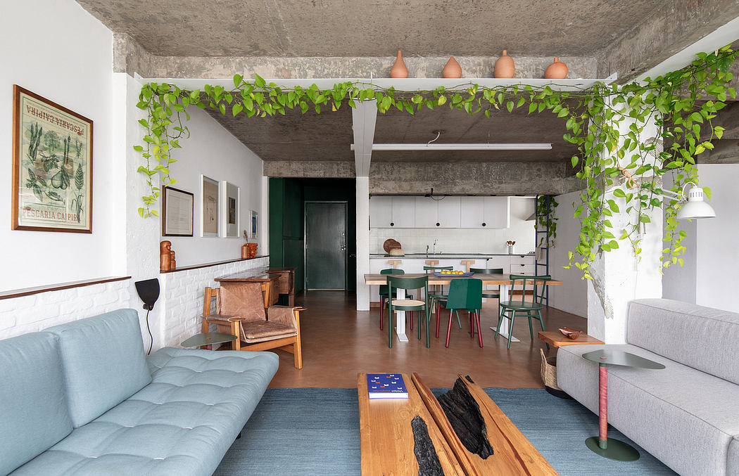 Cozy loft with concrete ceiling, greenery accents, and a mix of modern and vintage furnishings.