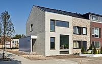 002-concrete-split-level-house-staggered-floors-and-textured-concrete-facade.jpg