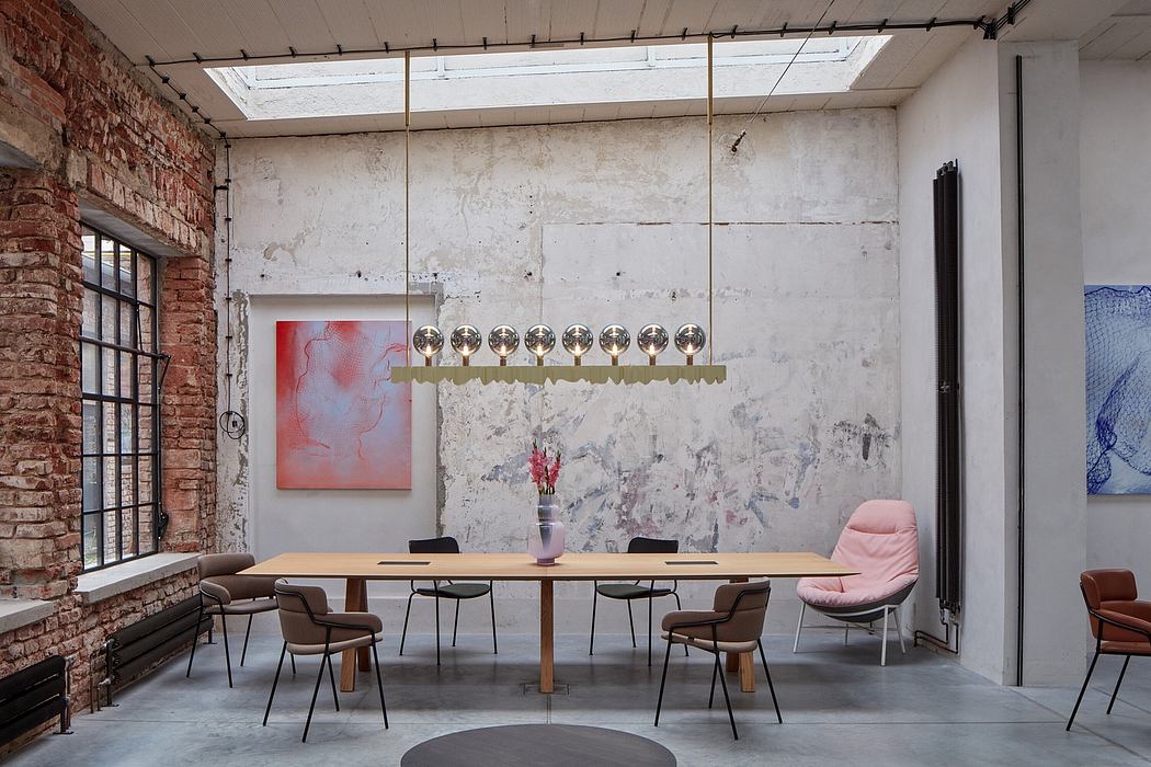 Expansive loft-like interior with exposed brick, contemporary lighting, and eclectic furnishings.