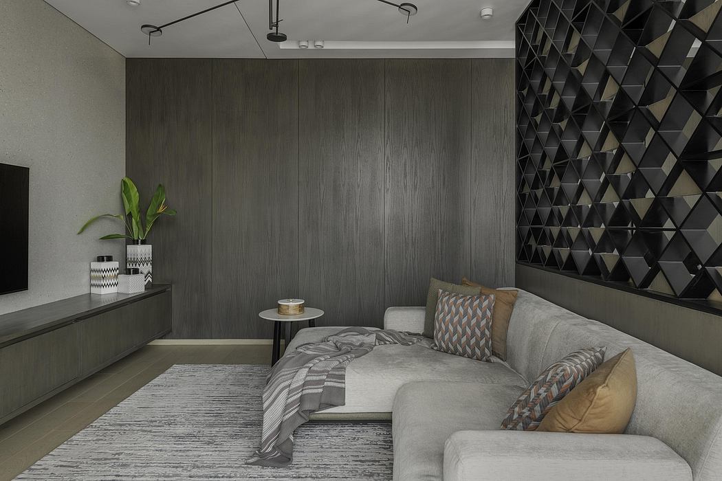 Modern bedroom with sleek gray wood paneling, geometric black accent wall, and plush gray sectional.