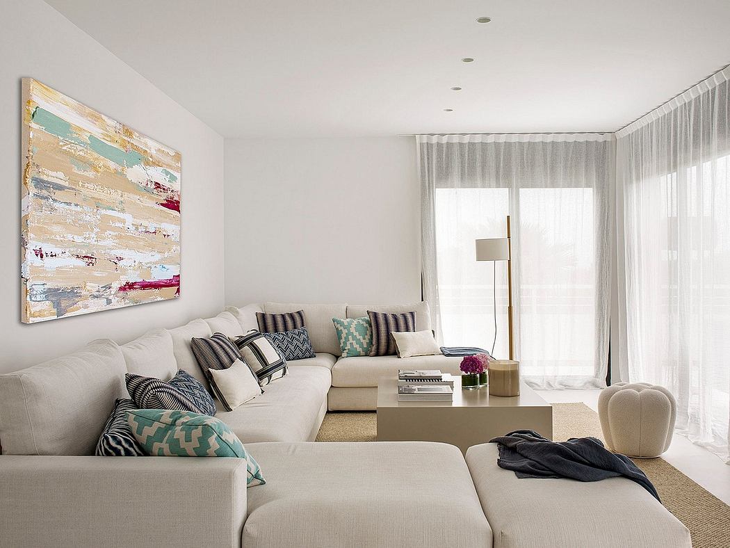 Bright, airy living room with contemporary decor, neutral colors, and abstract artwork.