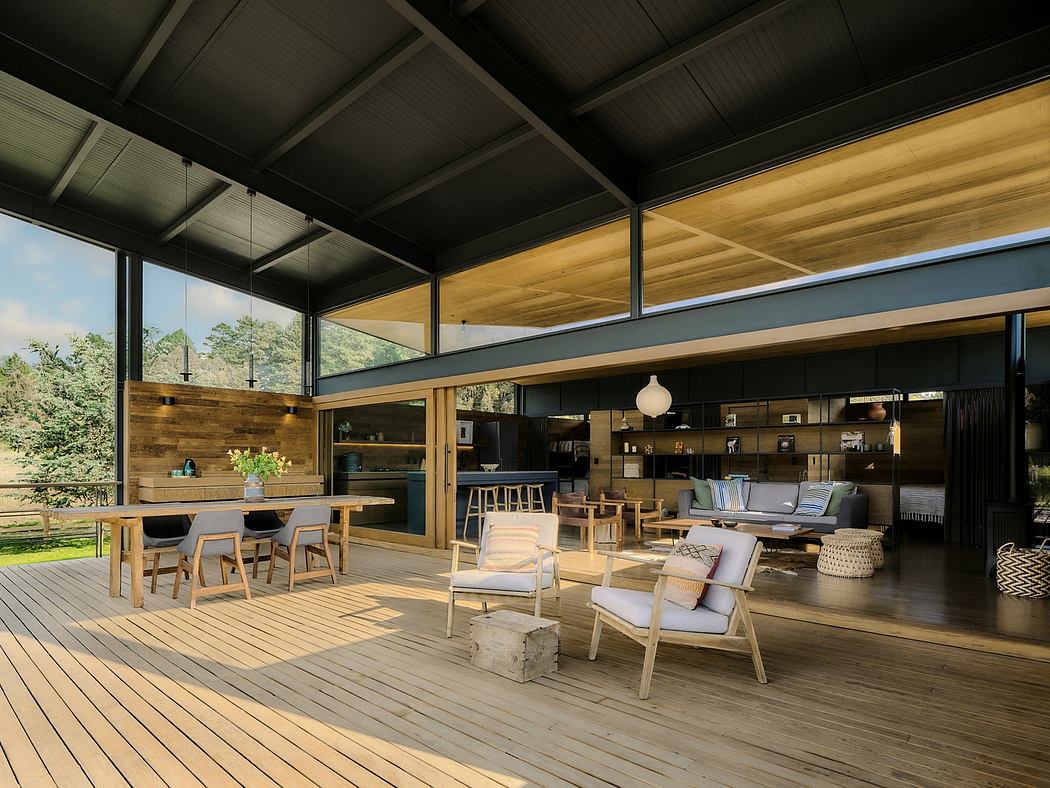 A modern, open-concept living space with a wooden deck, high ceilings, and large windows.