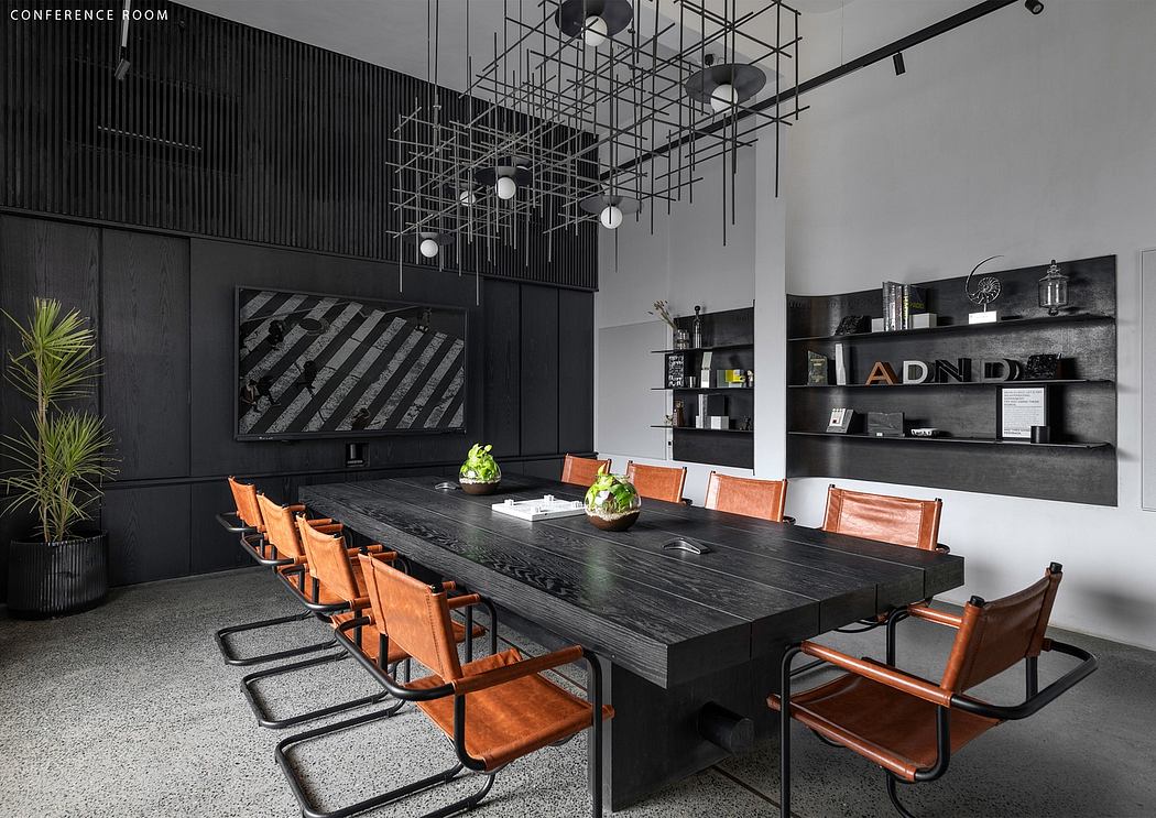 Sleek, modern conference room with black metal and wood furniture, industrial lighting.