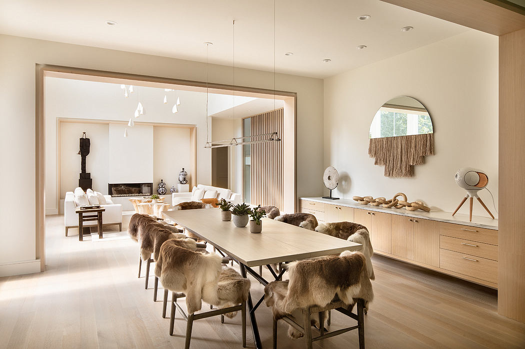 A contemporary, open-plan dining area with neutral tones, natural materials, and modern lighting.