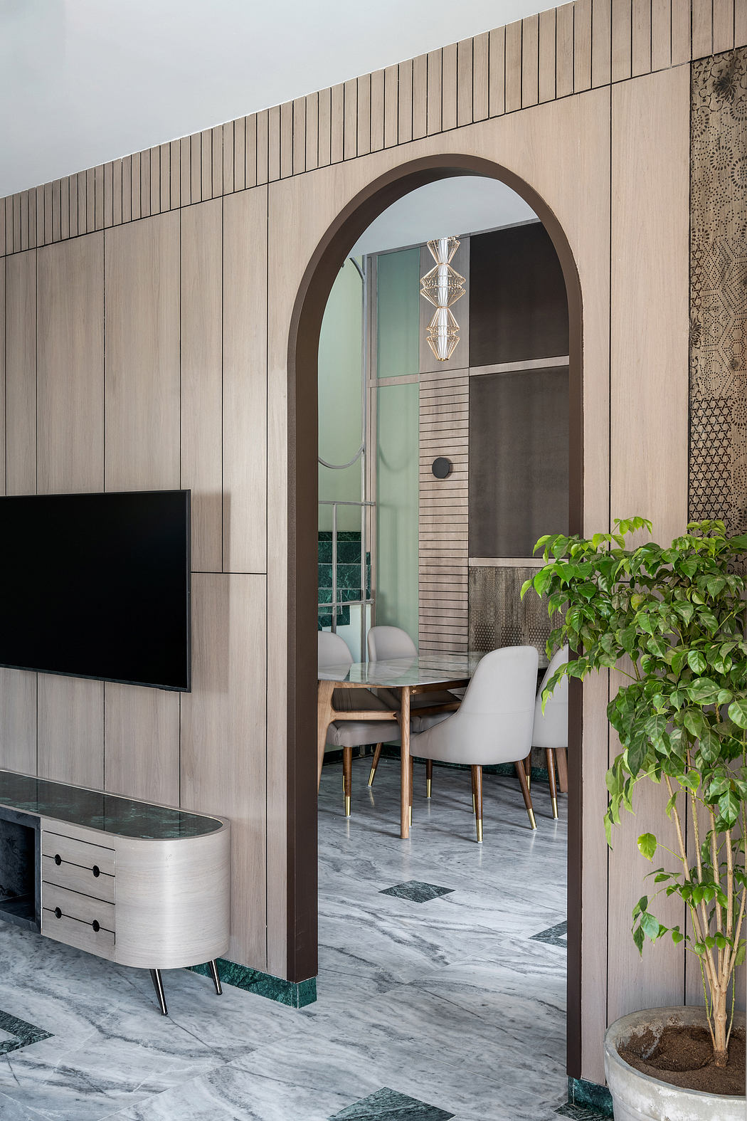 Sophisticated interior with arched doorway, wood paneling, and marble floors.