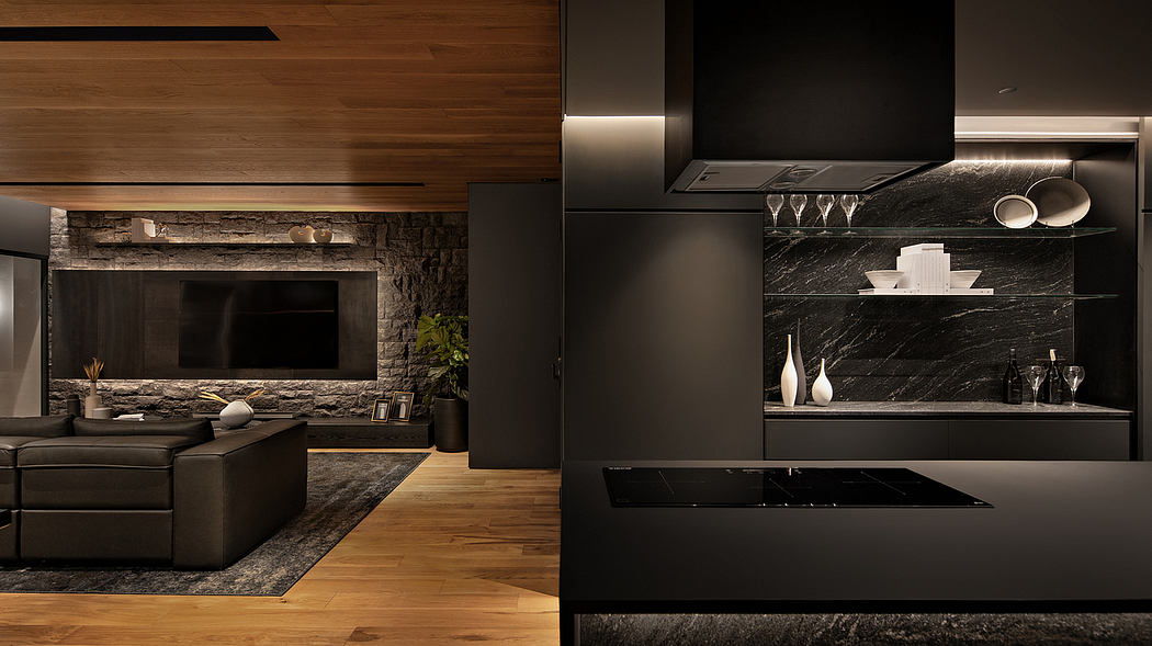 Sleek and modern kitchen design with dark marble countertops, wooden accents, and recessed lighting.